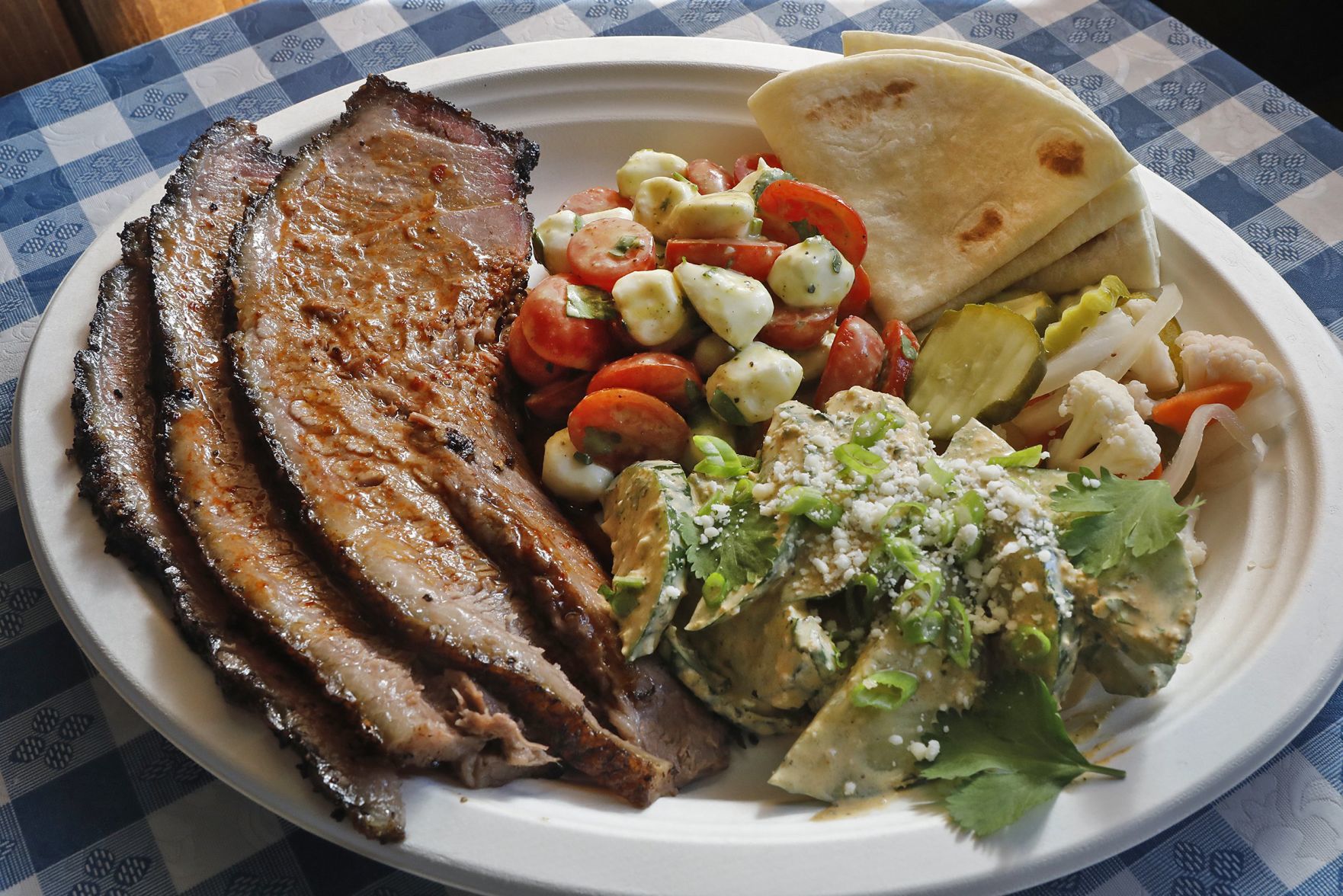 Trying a sample of Original J's Tex-Mex Barbecue